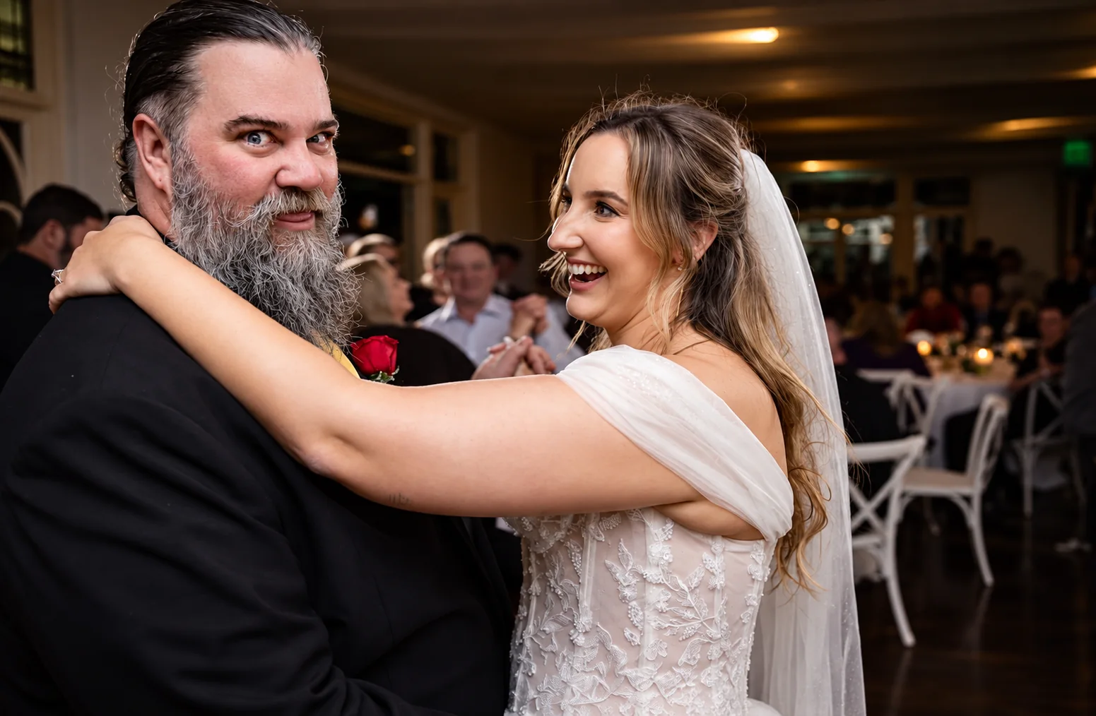Tricia and Bradley laughing together on the dance floor in The Gallery